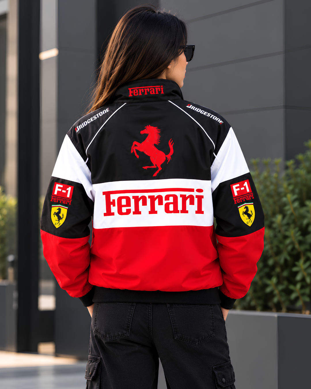 Female model showcasing back design of Ferrari inspired motorsport streetwear racing jacket