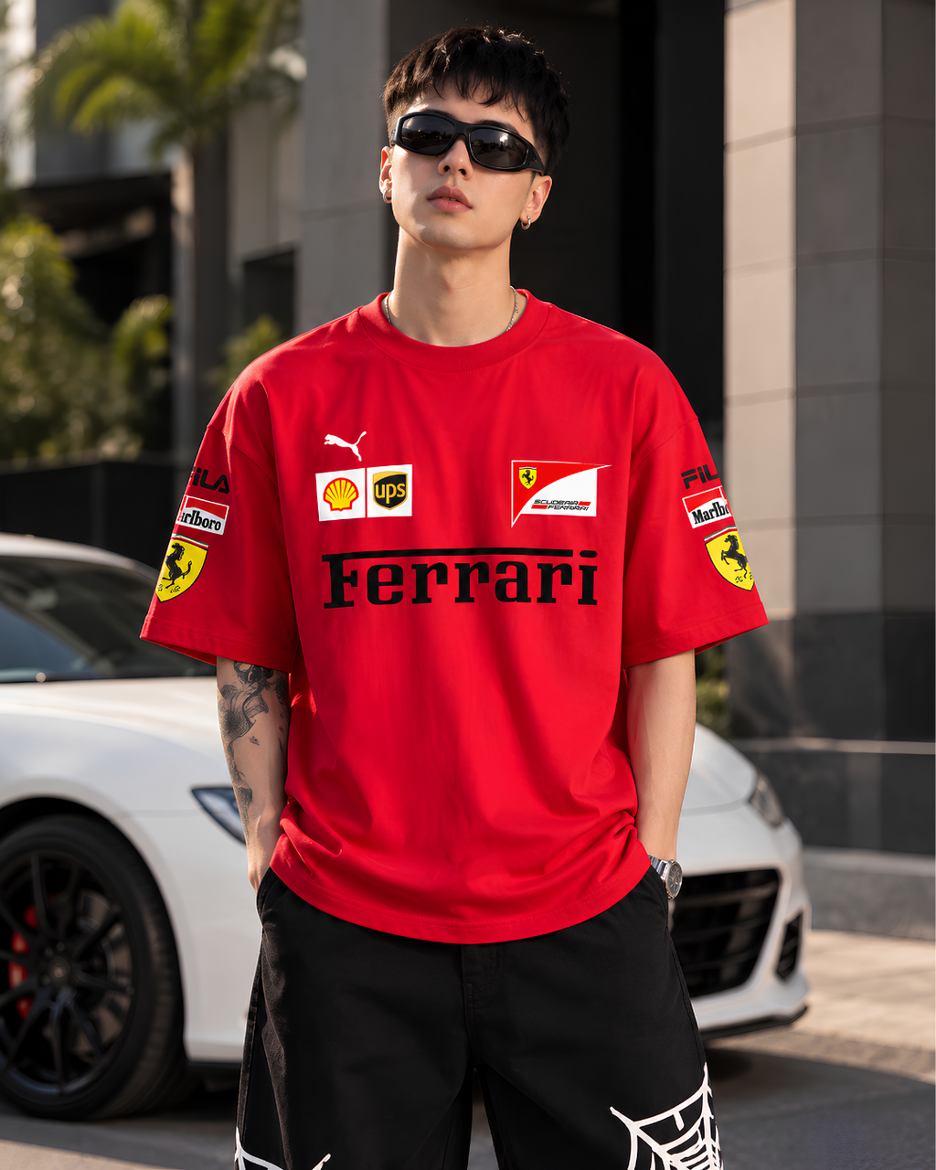 Model wearing red Ferrari inspired oversized racing T-shirt front view