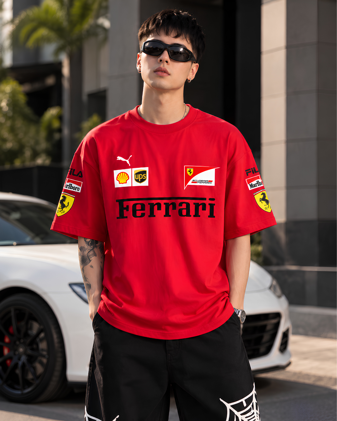 Model wearing red Ferrari inspired oversized racing T-shirt front view